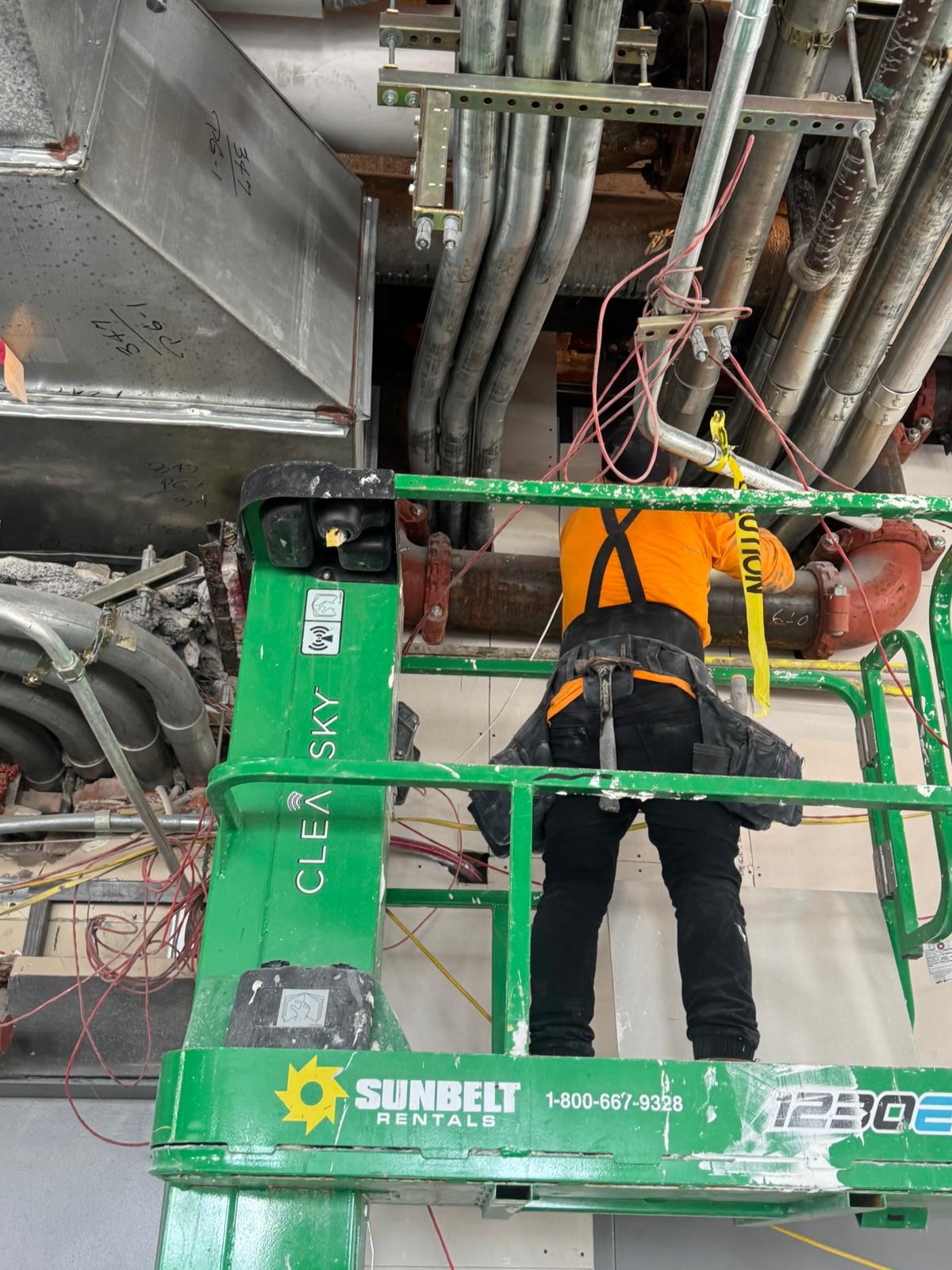 Tying in overhead where duct, conduit rack and sprinkler main share the same few inches